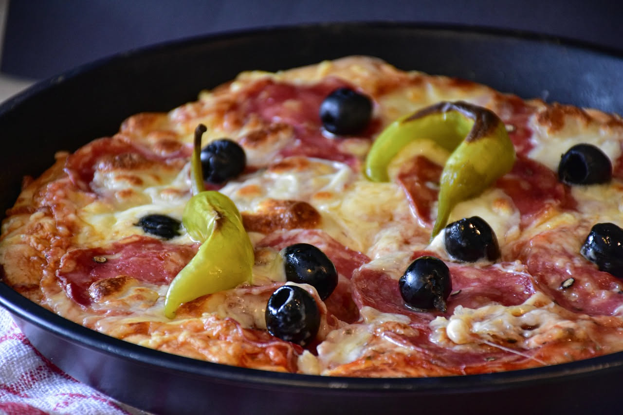 La plakous greca era l'antenata della pizza: cosa ci mettevano sopra